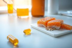 Fresh salmon slices on a white marble plate, close-up shot.  Healthy food, protein source, delicious meal.  Bright, natural lighting and shallow depth of field.
