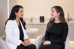 Doctor and patient in a calm cosmetic clinic consultation, suitable for cost discussion.
